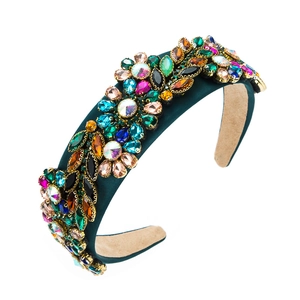 Baroque padded headband in dark green fabric with colorful crystals and rhinestones