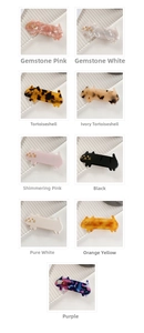 Detailed grid showing nine colors of acetate cat-shaped hair clips with gold facial details