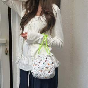 Quilted cartoon bear storage bag with neon green drawstring strap for travel and skincare