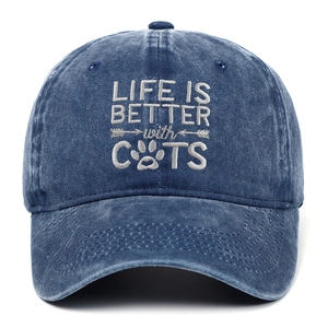 Detail of LIFE IS BETTER with CATS embroidery on washed navy blue cotton baseball cap
