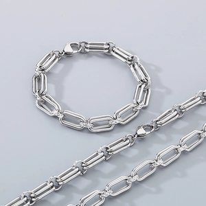 Polished silver stainless steel necklace and bracelet set with textured oval links