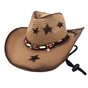 Brown straw cowboy hat with star print and colorful beaded band on a white background