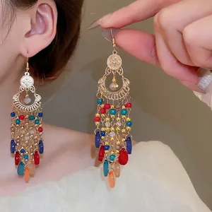 Bohemian beaded tassel drop earrings with vintage ethnic design and gold metal accents
