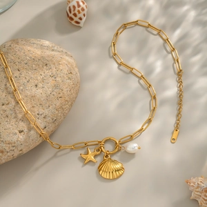 18K gold plated necklace with starfish, shell and pearl charms on a paperclip chain