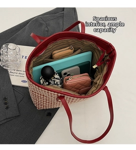 Interior view of spacious red woven tote bag showing large capacity and multi-pocket layout