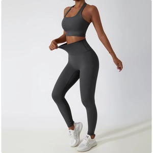 Detail of charcoal grey high-waist yoga leggings with elastic high-stretch fabric