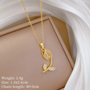 Macro view of golden tulip necklace with cat eye stone and tiny rhinestones detail