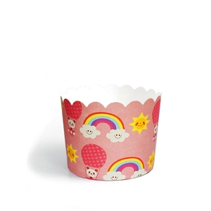 Detail of pink muffin paper cups with cartoon rainbow, clouds and panda balloon pattern