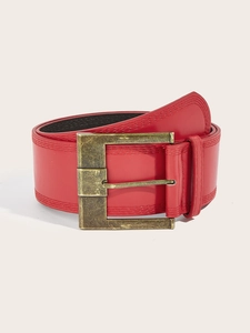 Close-up of red leather wide belt with a large vintage gold-tone square buckle