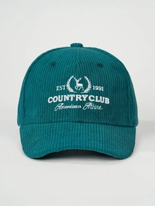 Detailed view of white elk embroidery on dark teal corduroy vintage baseball cap texture