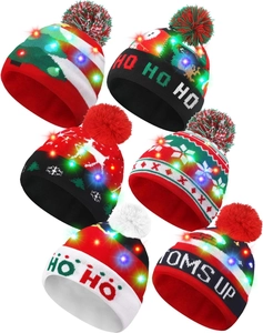 Detail of colorful LED Christmas knit hats featuring festive patterns and glowing lights