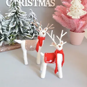 Handmade wool felt Christmas reindeer set with festive red scarves and snowflake embroidery