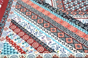Detailed macro view of bohemian jacquard fabric with ethnic geometric floral patterns