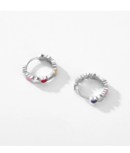 Macro detail of S925 sterling silver hoop earrings with colorful rainbow enamel hearts