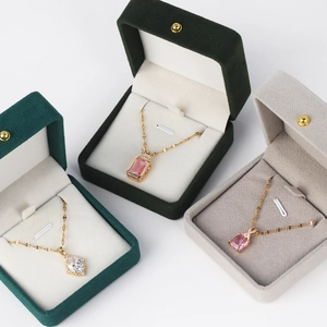 Cross pendant necklace with pink and white square diamonds on gold plated chains