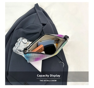 Interior view showing capacity of gradient rhinestone bag with phone and lipstick