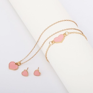 Elegant gold jewelry set featuring pink heart pendants on necklaces and bracelets
