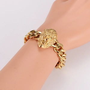 Men's gold stainless steel Cuban chain bracelet featuring a bold 3D lion head link