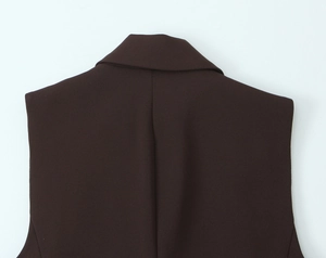 Detail of the dark brown waistcoat collar showing fine stitching and tailoring