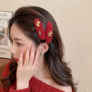 Set of luxury red faux fur hair clips with gold metal horse detail for women's hairstyle