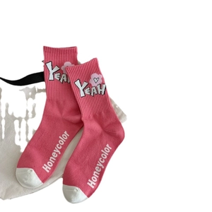 Pink cotton crew socks with 'YEAH' heart pattern and 'Honeycolor' text on white background