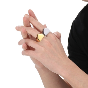 Men's geometric stainless steel rings in gold and silver finish on hand