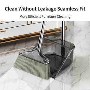 Modern transparent smoky grey broom and dustpan set with comb teeth for hair cleaning
