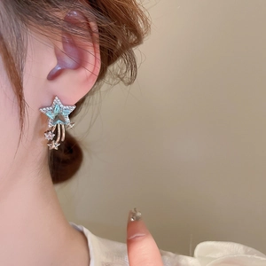 Elegant star-shaped drop earrings with light blue zircon stones and tassel dangles