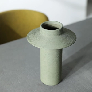 Modern light green brushed ceramic vase with matte circular texture for home decor