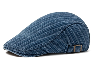 Detailed view of striped cotton newsboy cap featuring an adjustable bronze metal buckle