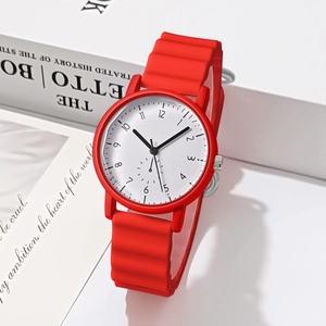Close-up of red wavy silicone strap and white dial with Arabic numerals on sports watch