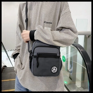 On-body shot of the casual crossbody bag with mesh pocket and adjustable strap