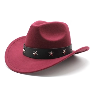 Detail of burgundy western cowboy hat featuring black leather band and silver star studs