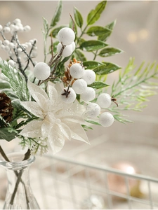 Macro detail of artificial Christmas spray with white berries and natural pine cones