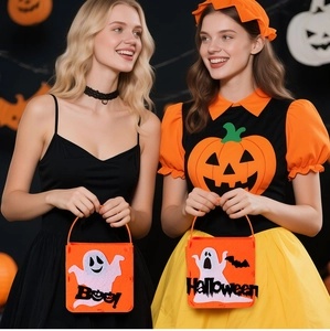 Detailed view of Halloween felt candy bags with ghost patterns and Boo lettering