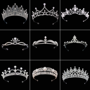 Nine styles of silver bridal tiaras with rhinestones and pearls on black background