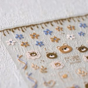 3D embossed bear and floral nail art stickers with gold and blue decorative patterns