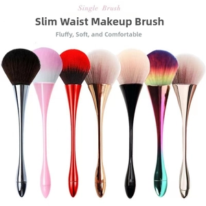 Close-up of ergonomic colorful waist-shaped handles on a variety of soft powder brushes