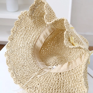 Beige wide-brim straw sun hat with inner sweatband, adjustment string and checkered bow