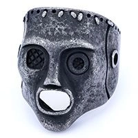 Detailed view of gothic skull mask ring in antique silver finish for punk style fashion