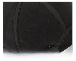 Detailed macro view of the warm fleece lining and stitching inside a winter baseball cap