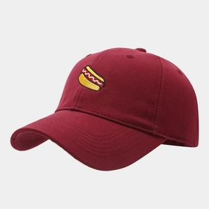 Close-up of hot dog embroidery on a burgundy cotton twill baseball cap with curved brim