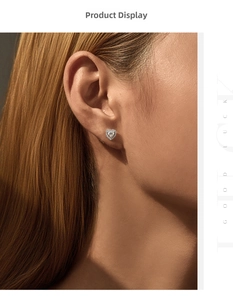 Close-up of heart-shaped moissanite stud earring in sterling silver on a female model