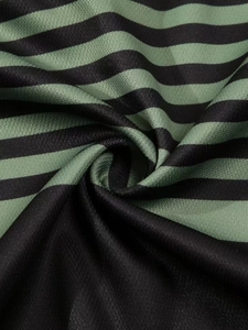 Close-up of breathable striped polo shirt fabric with detailed crepe texture and drape