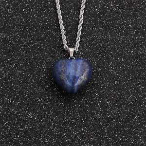 Detail shot of heart-shaped blue lapis lazuli pendant with a silver twist chain
