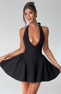 Detailed close-up showing the deep V-neck and backless design of a black mini dress