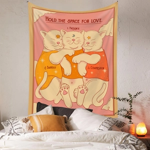 Detailed view of cat tapestry with inspirational quotes hanging above a bedroom bed
