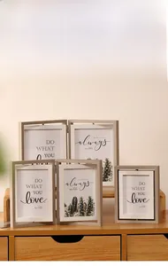 Detail of light wood grain rotating photo frames in various sizes for home decor