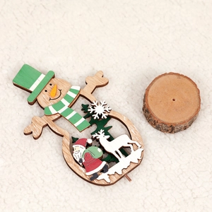 Creative wooden Christmas tree ornament featuring Santa and reindeer on white fabric background