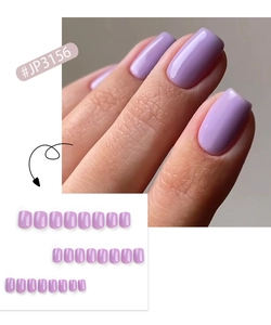 Detailed view of lavender short square press-on nails with a glossy finish on a hand